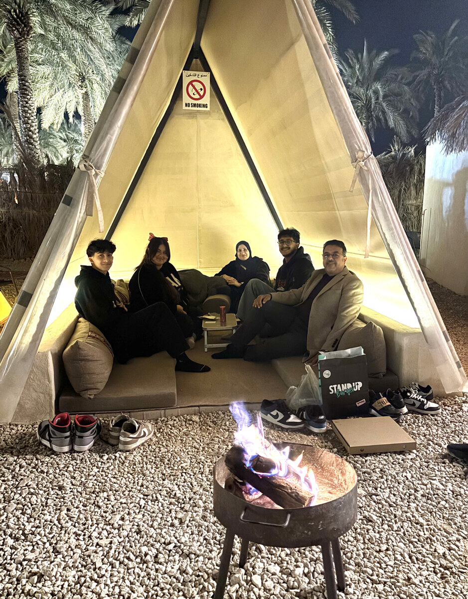 Malak Hassan and her family gathered in one of Dakkah Winter’s intimate tents. (AN photo by Waad Hussain)