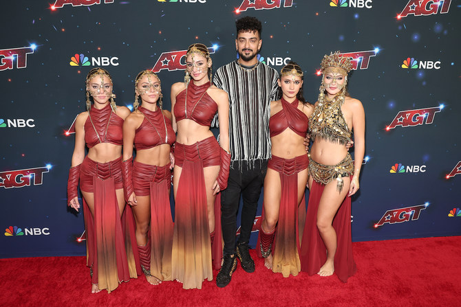 Led by founder and choreographer Nadeem Cherfan, the troupe danced in maroon to Arabic tunes with gold chain face accessories.  (Getty Images)