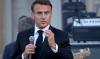 Législatives: Macron renvoie les extrêmes dos à dos, la gauche parle économie