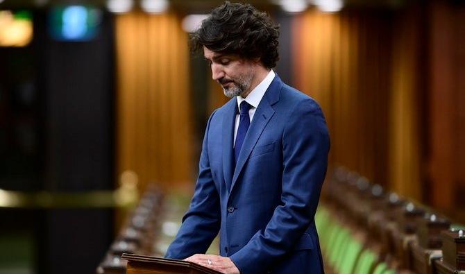 Le premier ministre Justin Trudeau participe à une minute de silence à la Chambre des communes sur la Colline du Parlement à Ottawa le mardi 8 juin 2021 en réponse aux récents événements à London, en Ontario (AFP)