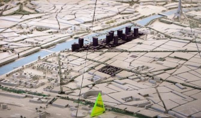 Une maquette de la future Tour Triangle (en jaune), un projet de gratte-ciel conçu par Unibail-Rodamco-Westfield (URW), à Paris. (Photo, AFP)