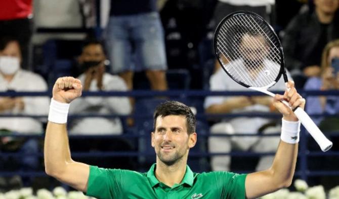 Novak Djokovic célèbre après sa victoire contre Karen Khachanov, lors de leur match de tennis ATP Dubai Duty Free, le 23 février 2022. (Photo, AFP)