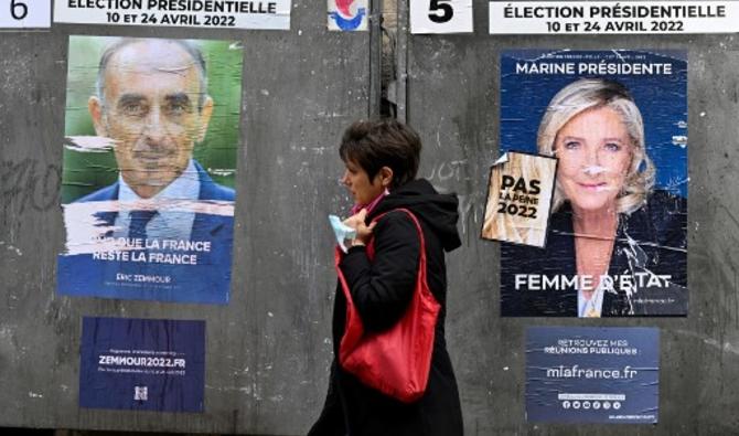Les affiches de campagne du parti d'extrême droite français Reconquete ! Le candidat à la présidentielle Eric Zemmour (L) et la candidate à la présidence du Rassemblement national (RN) français Marine Le Pen (R), trois jours avant le premier tour de l'élection présidentielle française, à Paris, le 7 avril 2022. (Photo, AFP)