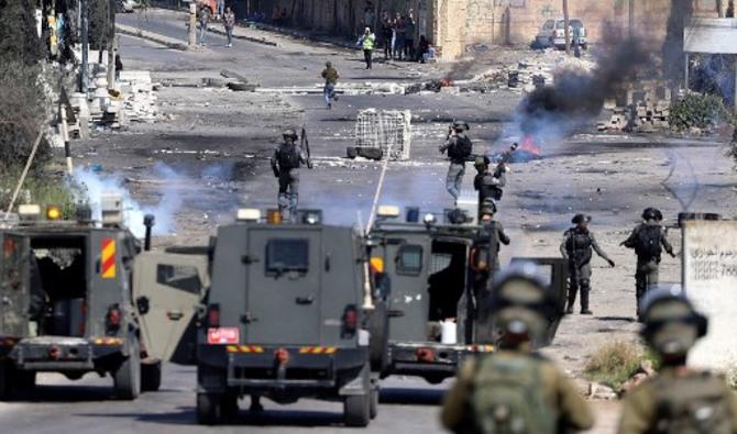 Plus de 150 Palestiniens ont été blessés vendredi lors de ces heurts, faisant craindre un embrasement dans les Territoires palestiniens. (Photo, AFP)