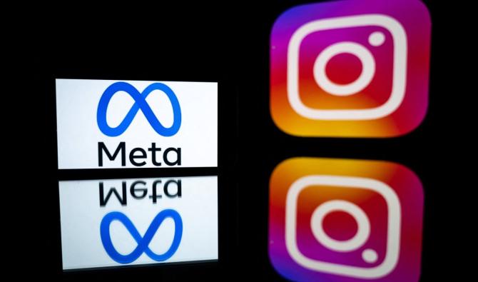 Cette photo prise le 12 janvier 2023 à Toulouse, dans le sud-ouest de la France, montre un smartphone et un écran d'ordinateur affichant les logos de l'application Instagram et de sa société mère Meta. (AFP)